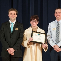 Faculty award recipient Jean Barry posing for a photo with the GSA president and GSA member